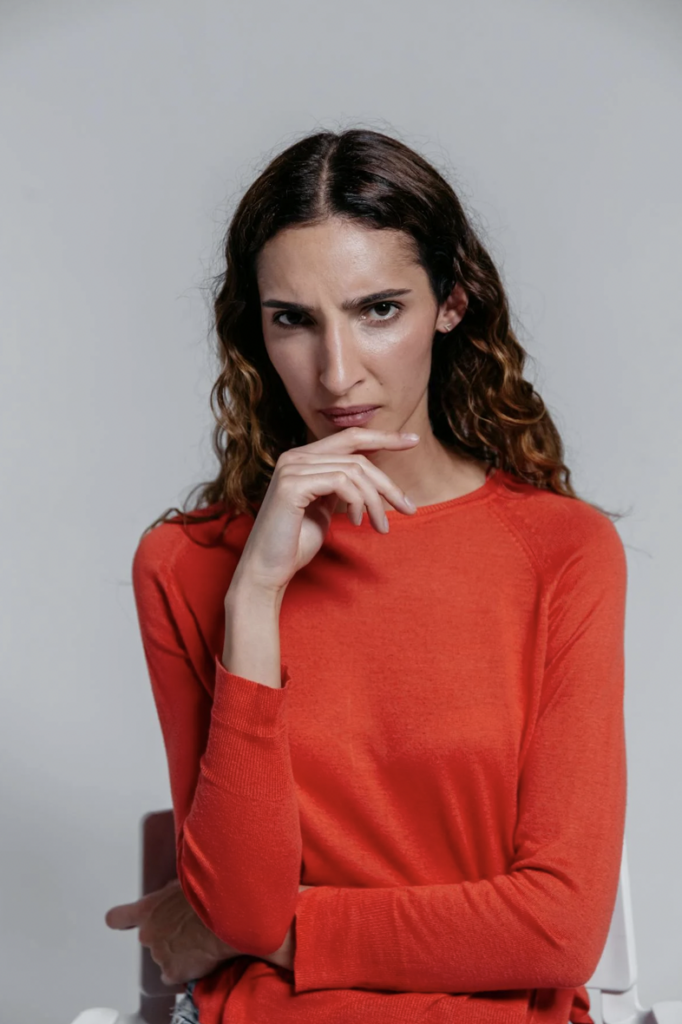 Woman expressing doubt nonverbally